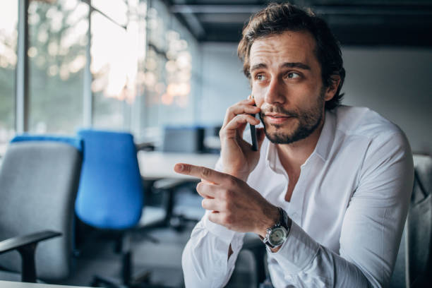 istock Businessman talking on mobile in office 1138576119