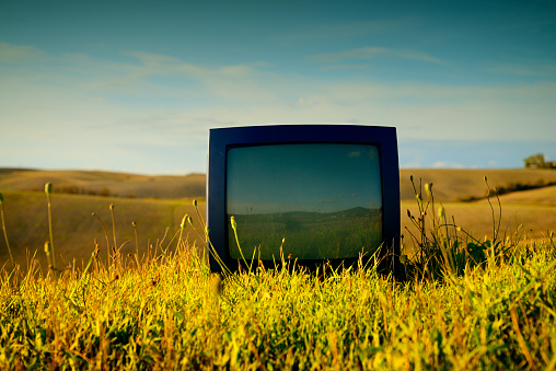 Abandoned Television in a Field.