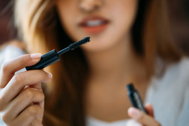 istock Asian woman showing black mascara 1138578865