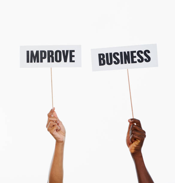 istock Two hands hold up signs reading 