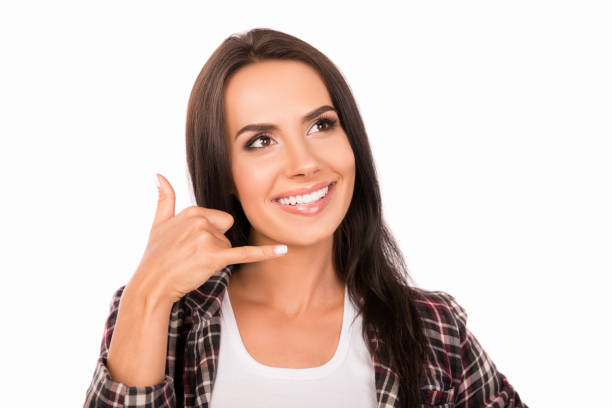 istock Creative smiling girl gesturing and asking to call her 1138580237