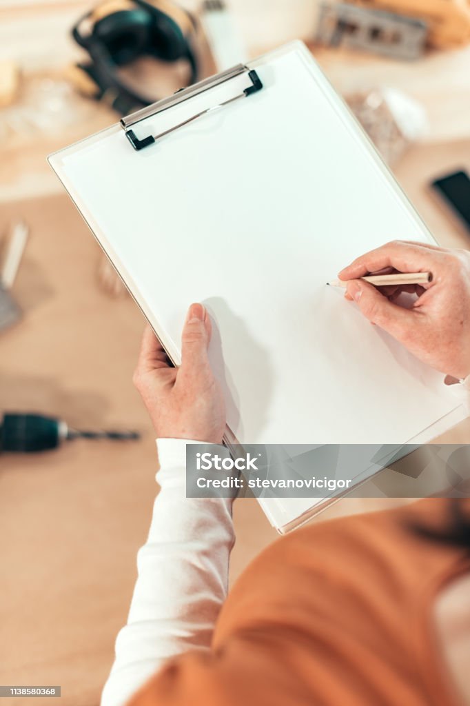 Carpenter Writing Female Carpenter Writing Diy Project Notes Stock Photo - Download Image ...