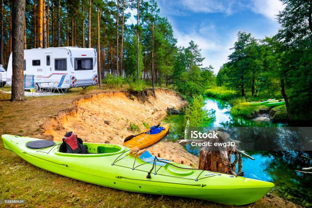 Summer vacation with a camper by the river Summer vacation with a camper by the river Wda, Kashubia, Poland Motor Home Stock Photo