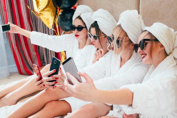 istock selfie time bathrobe girls fun relaxation habit 1138582337