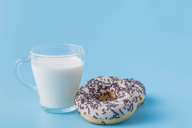 istock Fresh glass of milk on blue background 1138582908