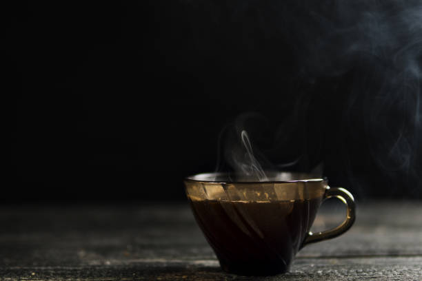 istock Mug of hot espresso on a dark background 1138583145