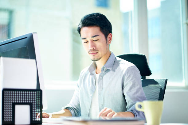 istock young asian businessman working in office 1138583314