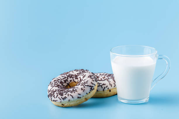 istock Milk in a glass on a blue background 1138583420
