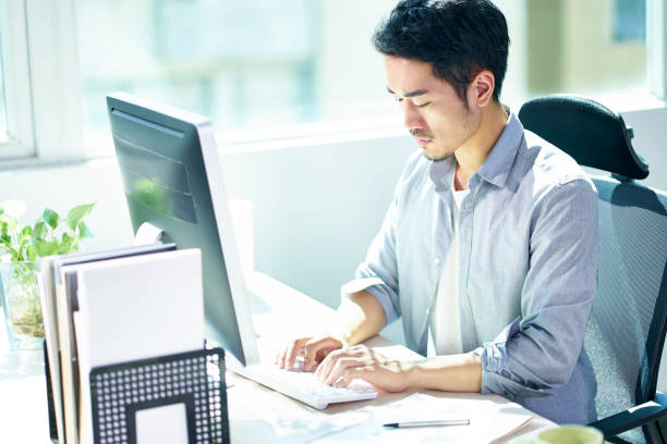 istock young asian businessman working in office 1138583476