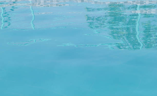 istock Blue water in swimming pool at hotel 1138583524
