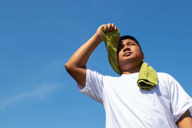 istock Young man and heat stroke. 1138585615