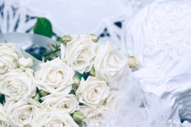 istock Bouquet of white roses and wedding attributes. Wedding background 1138585643