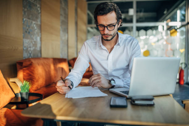 istock Businessman working in cafe alone 1138585947