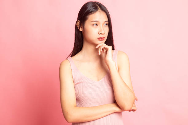 istock Serious  young Asian woman  look away. 1138585969
