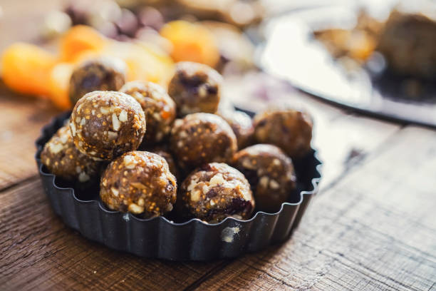 Healthy energy balls made of dried fruits and nuts Healthy energy balls made of dried fruits and nuts plasma ball stock pictures, royalty-free photos & images