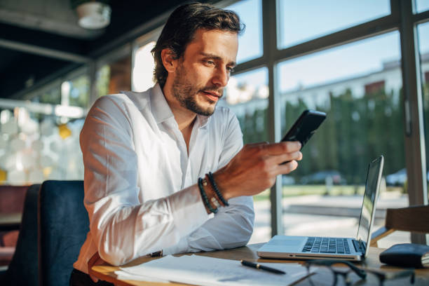 istock Young businessman in cafe alone 1138587726
