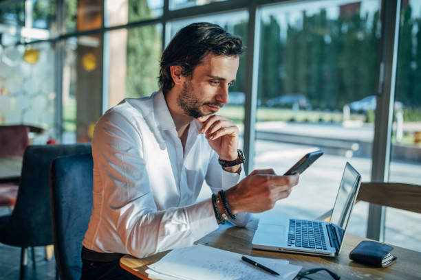istock Handsome businessman sitting in cafe 1138587771