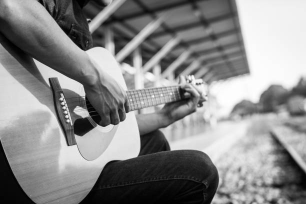 istock Playing on acoustic guitar outdoor 1138589237