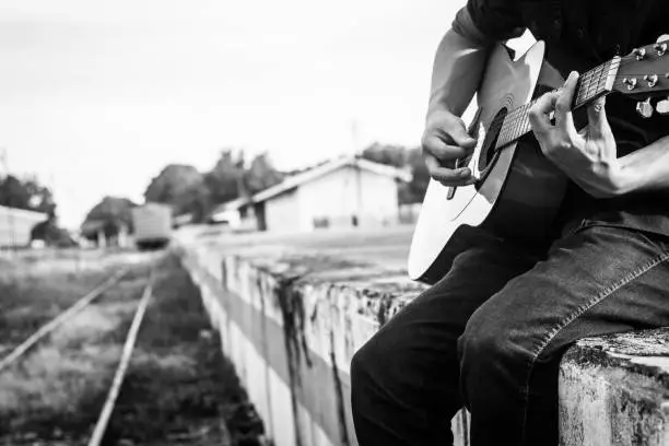 Photo of Playing on acoustic guitar outdoor