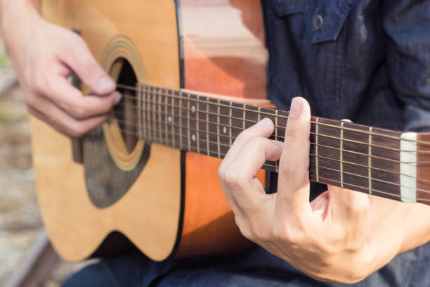 istock Playing on acoustic guitar. Close-up. 1138589526