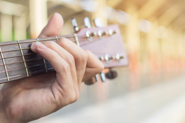 istock Playing on acoustic guitar. Close-up. 1138589577
