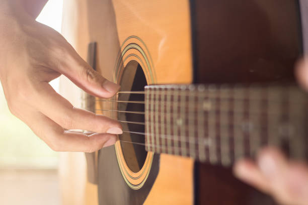 istock Playing on acoustic guitar. Close-up. 1138589609