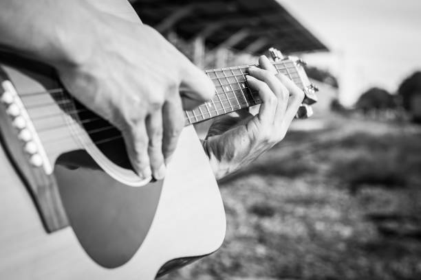 istock Playing on acoustic guitar outdoor. Close-up 1138590210
