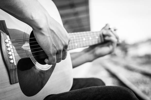 istock Playing on acoustic guitar outdoor. Close-up 1138590322