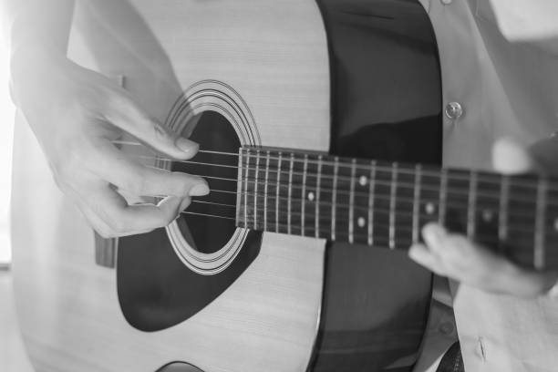 istock Playing on acoustic guitar. Close-up. 1138590333