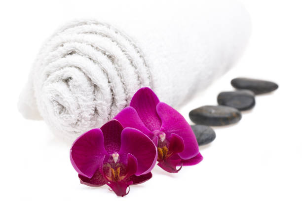 istock Towel, stones and flowers isolated on white background 1138590677