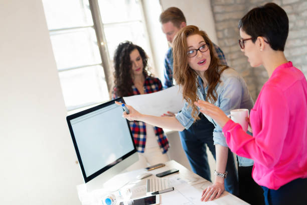 istock Business people and architects collaborating on project 1138592069