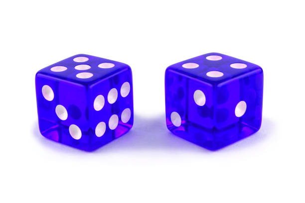 istock Two blue glass game dice very close up isolated on white background. Five and four with a shadow. 1138592760