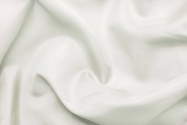 istock Texture of silk smooth fabric. Background pastel colors 1138594435