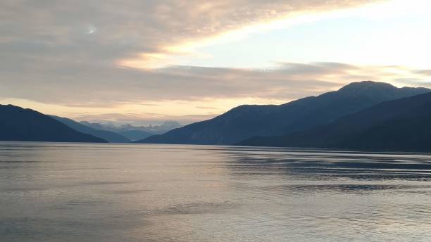 istock Sunset over Mountains on the Inside Passage in Alaska 1138595778