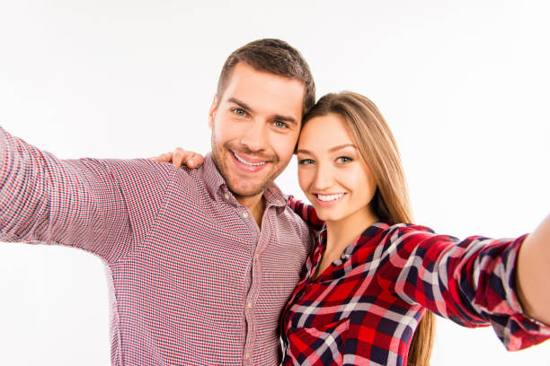 istock Hipster couple in love making selfie 1138596894