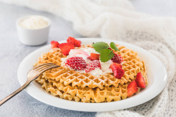 istock Waffles with strawberries and whipped cream 1138597031