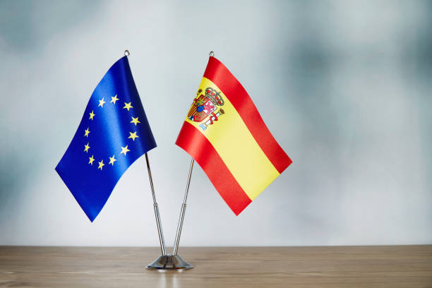 istock European Union and Spanish flag standing on the table 1138600636