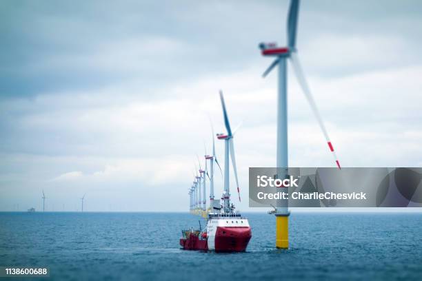 Big Offshore Windfarm With Transfer Vessel Stock Photo - Download Image Now - Sea, Offshore Platform, Wind Turbine