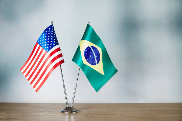American and Brazilian flag standing on the table