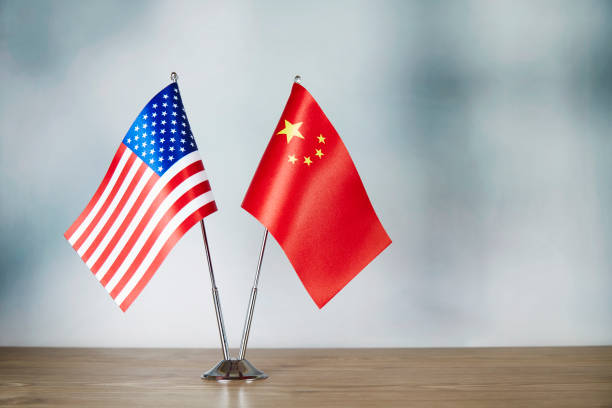 istock American and Chinese flag standing on the table 1138600862