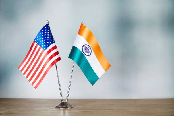 American and Indian flag standing on the table