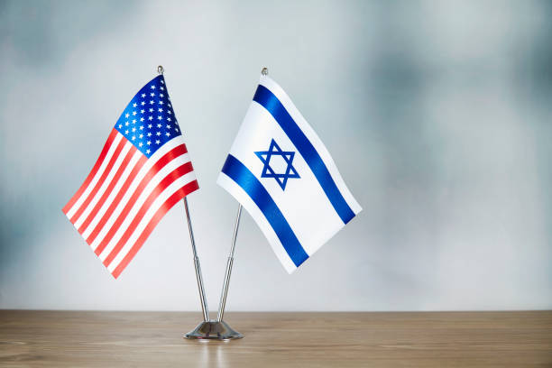 istock American and Israeli flag standing on the table 1138601434
