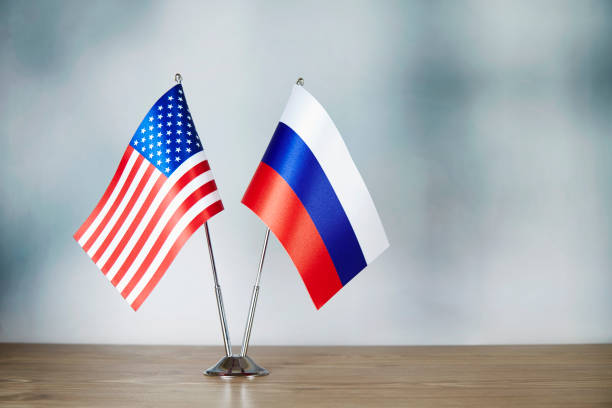 istock American and Russian flag standing on the table 1138601485