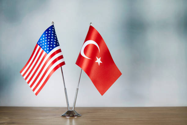 istock American and Turkish flag standing on the table 1138601574
