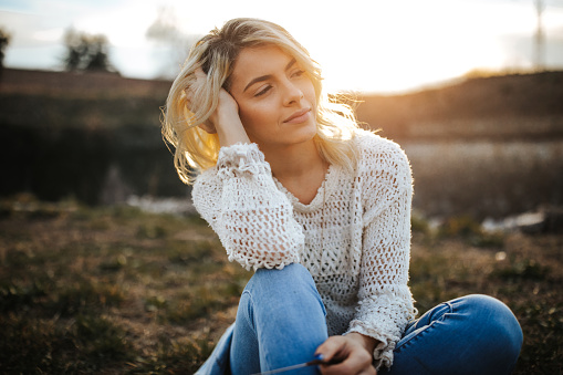 Beautiful blonde woman outdoors