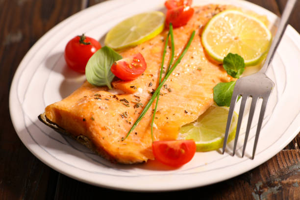 istock salmon fillet with lemon and tomato 1138604333