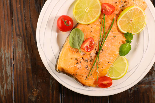 istock salmon fillet with lemon and tomato 1138604336