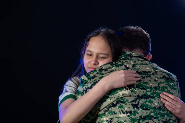 istock Soldier hugs daughter on departing or returning 1138608668