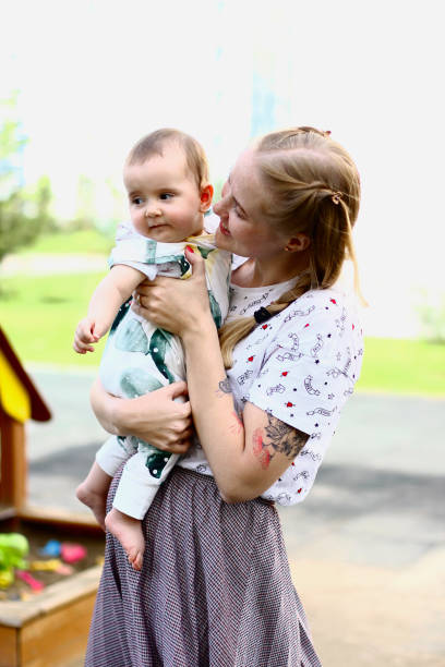 istock Young mother with a baby in her arms 1138610130
