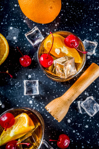 istock Whiskey with orange and cocktail cherries 1138611312